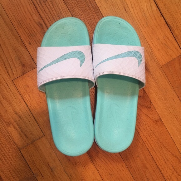 teal and white nike slides